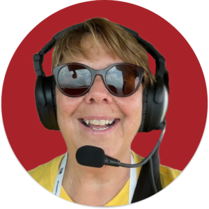 A white woman with sunglasses and a pilot's headset