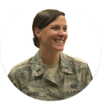 A white woman smiling in U.S. Air Force camo